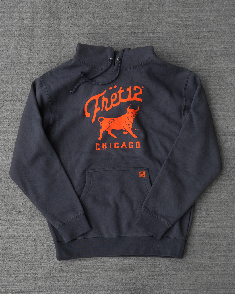 This asphalt colored hoodie features a Chicago-centric screen print of a bull on the chest in orange.