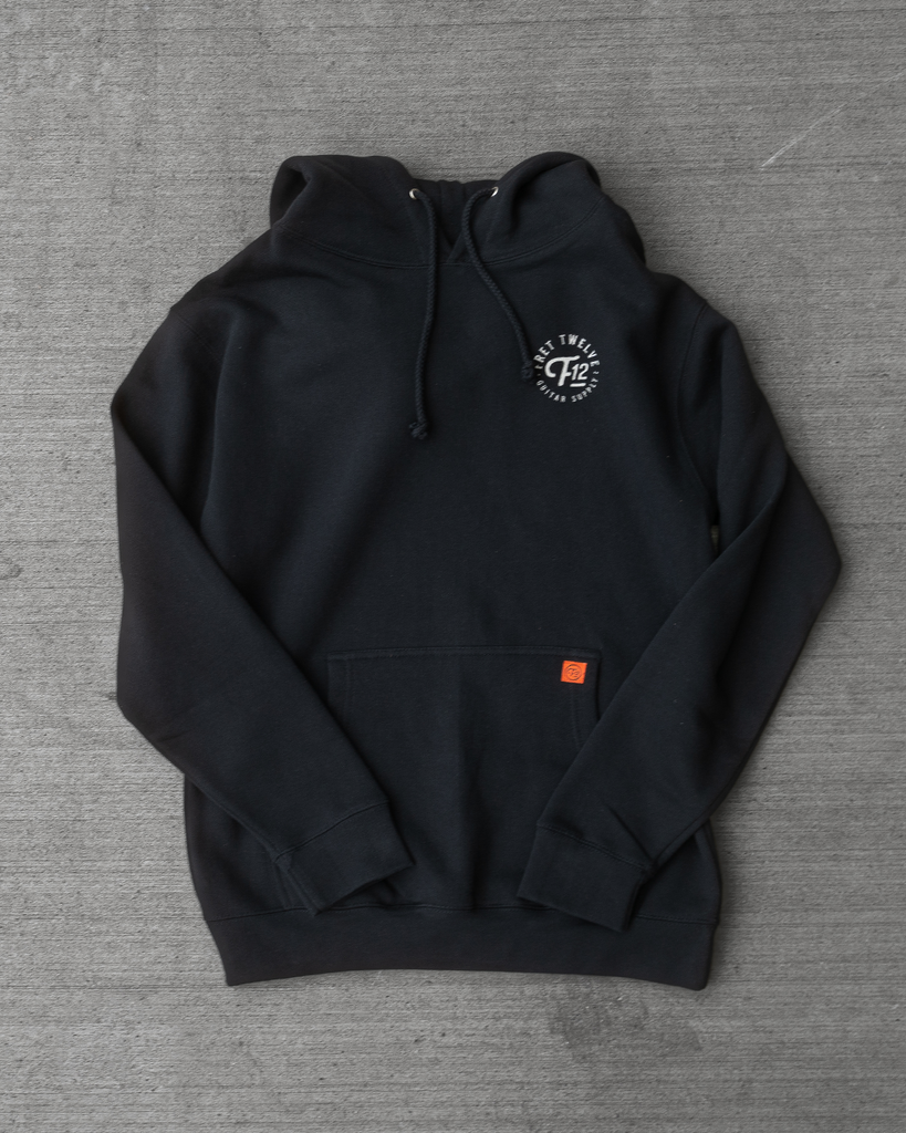 This hoodie features a FRET12 cult favorite  graphic – a skull wrapped in guitar strings and sealed with a type lockup.