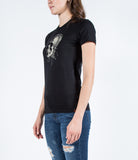 Sideview of model wearing Strung Out Skull tee.